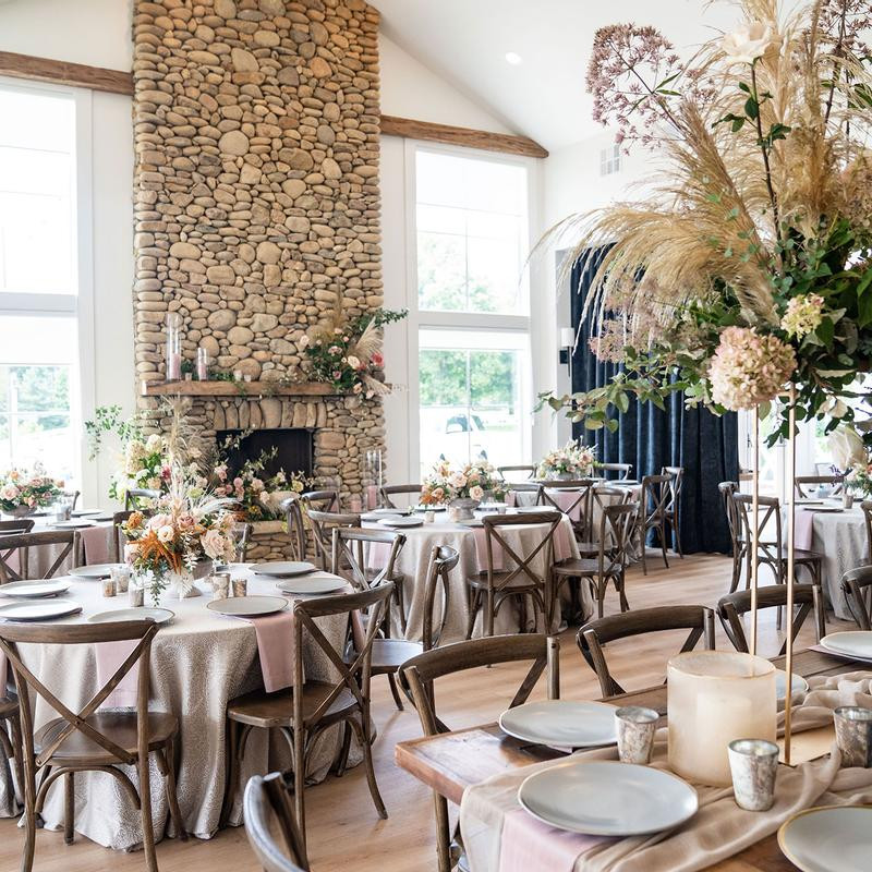 Room with elegantly arranged tables and chairs.